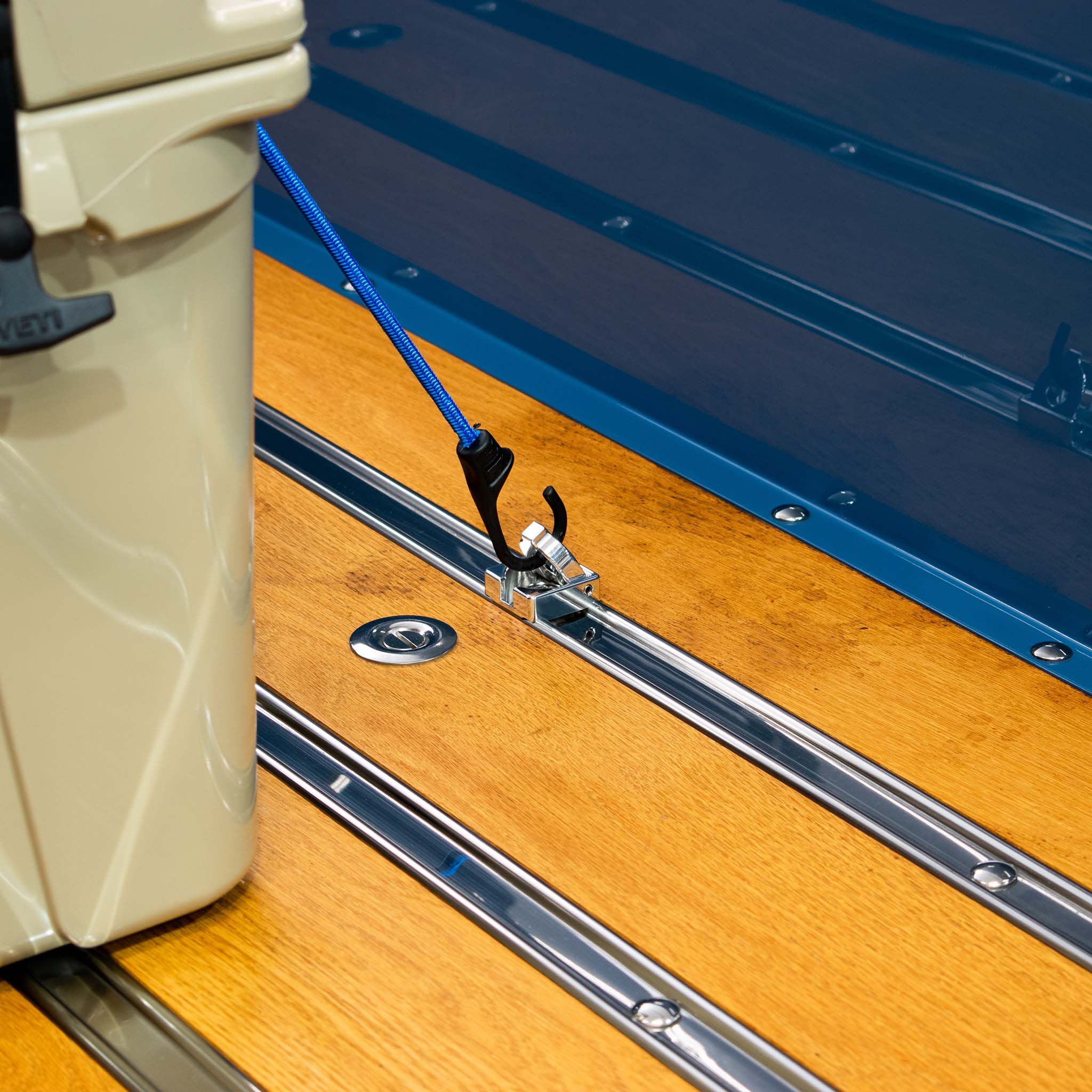 Polished Bed Hook Installed In Truck Holding Down An Ice Chest